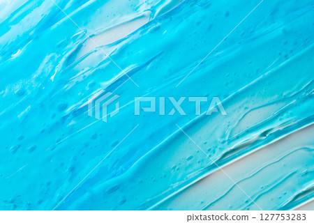 The texture of a blue cosmetic gel on a white background 127753283