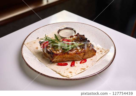 Grilled pork ribs with rosemary and chili 127754439