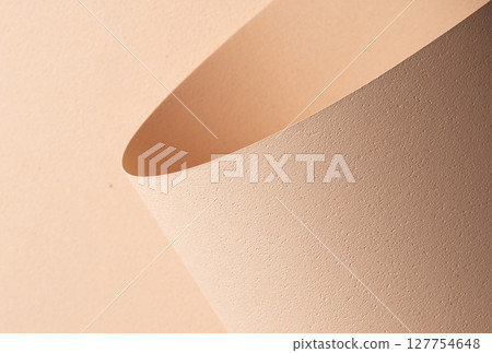 Chic designer paper closeup. Monochrome background in beige and cream color with matte grained 127754648