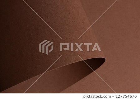 Elegant designer paper background in chocolate brown coffee tones with pitted porous texture and Elegant designer paper background in chocolate brown coffee tones with pitted porous texture and 127754670