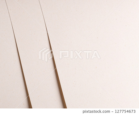 Elegant designer paper in beige and cream tones with porous speckled texture and organic fiber. 127754673
