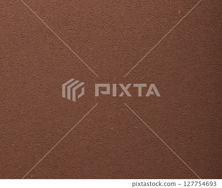 Flat designer paper in chocolate brown tones with smooth surface and pitted porous texture. Elegant 127754693
