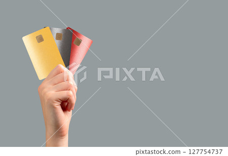 holding a bank card for secure payment at a retail store. Multiple options for transaction, holding a bank card for secure payment at a retail store. Multiple options for transaction, 127754737