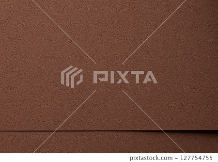 Luxury background with overlapping sheets of designer paper in rich chocolate brown tones. Pitted 127754755
