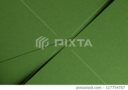 Premium paper surface close up. Green matte texture with smooth fiber detail, geometric overlap of Premium paper surface close up. Green matte texture with smooth fiber detail, geometric overlap of 127754787