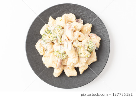 Cream Tteokbokki Korean Rice Cake with Bacon and Broccoli on White Background Cream Tteokbokki Korean Rice Cake with Bacon and Broccoli on White Background 127755181