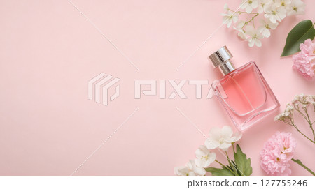 Feminine flat lay with pink perfume, sunglasses, and spring flowers on pastel background, ideal for beauty product mockups. 127755246