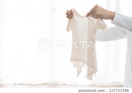 My mother at home preparing for the birth of her grandchild while looking forward to it My mother at home preparing for the birth of her grandchild while looking forward to it 127755396