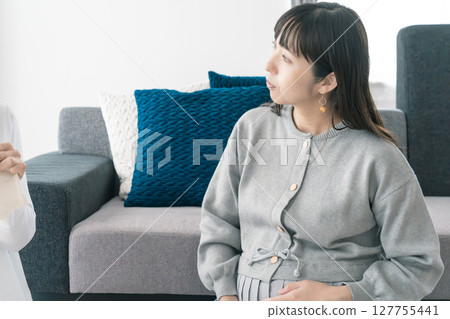 Mother and daughter talk about a bright future while preparing for birth Mother and daughter talk about a bright future while preparing for birth 127755441