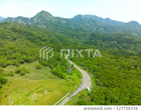 Aerial view of the top of Unseki Pass in Yakumo Town, Hokkaido in early summer Aerial view of the top of Unseki Pass in Yakumo Town, Hokkaido in early summer 127756158