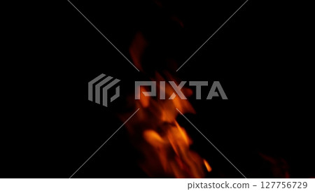 Dynamic Flames Dance in the Dark Enveloping the Night, Creating a Hypnotic Atmosphere 127756729