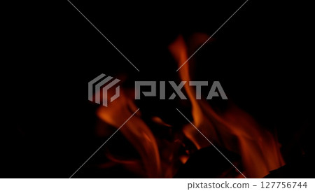 The Captivating Flames Dance Gracefully in the Dark of Night, Creating a Hypnotic Visual The Captivating Flames Dance Gracefully in the Dark of Night, Creating a Hypnotic Visual 127756744