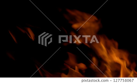Dynamic Flames Against a Dark Background, Evoking Intense and Vibrant Imagery of Heat and Fire Dynamic Flames Against a Dark Background, Evoking Intense and Vibrant Imagery of Heat and Fire 127758067