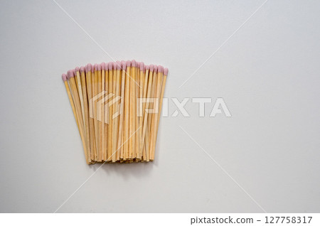 Pink matches sticks on bright background, copy space 127758317