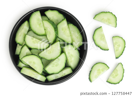 Sliced cucumber in ceramic bowl isolated on white background with full depth of field. Top view. Flat lay. 127758447