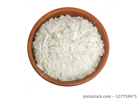 White flour in ceramic bowl isolated on white background. Top view. Flat lay. White flour in ceramic bowl isolated on white background. Top view. Flat lay. 127758473