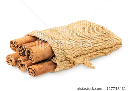 Cinnamon sticks in a bag isolated on white background with full depth of field 127758481