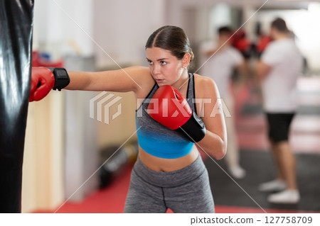 Woman training in boxing section Woman training in boxing section 127758709