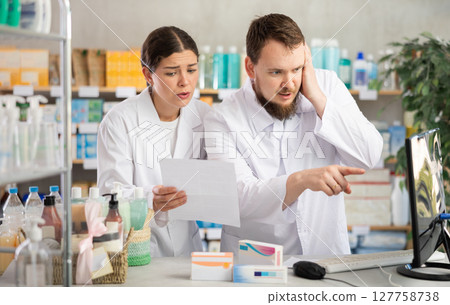 Director and pharmacist analyze documents, are horrified by results of work in current half-year Director and pharmacist analyze documents, are horrified by results of work in current half-year 127758738