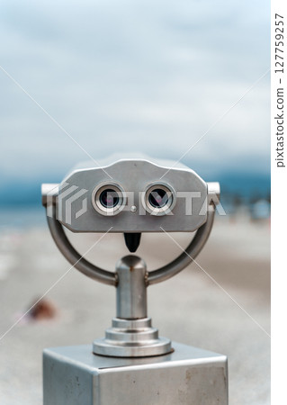 Seaside Binocular Viewer with Blurred Beach Background Seaside Binocular Viewer with Blurred Beach Background 127759257