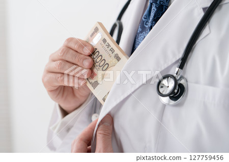Man in white coat money 127759456