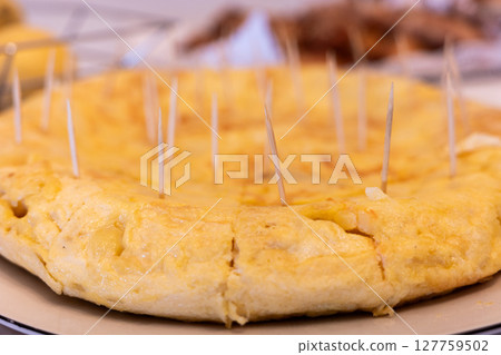 Traditional Spanish Omelette with Toothpicks Ready to Serve 127759502