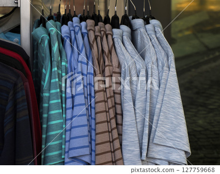 colorful clothes shirt hanging in street market store 127759668