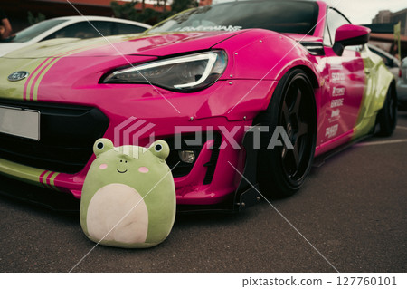 KYIV, UKRAINE - JUNE 8, 2024: Modified striking two-tone pink and lime green job Subaru BRZ KYIV, UKRAINE - JUNE 8, 2024: Modified striking two-tone pink and lime green job Subaru BRZ 127760101