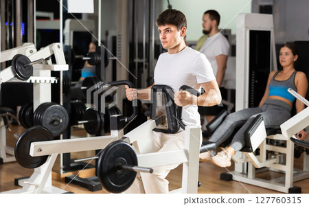 Guy doing strength training on his back 127760315