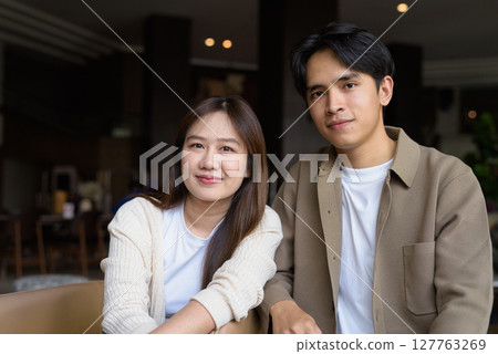 Portrait of a happy young couple indoors 127763269