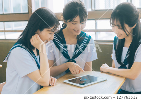 High school students using tablets in group study 127763512