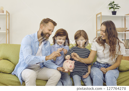 Mom and dad teach their sons to manage their budgets effectively and spend money wisely. Mom and dad teach their sons to manage their budgets effectively and spend money wisely. 127764278