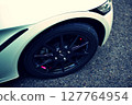 Black wheels on a white sports car 127764954