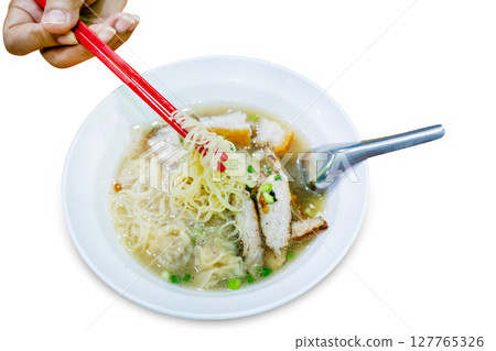 Top view of Noodle soup with red pork and chopsticks, focus selective 127765326