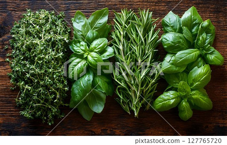 Fresh green herbs on rustic wood background culinary food photography Fresh green herbs on rustic wood background culinary food photography 127765720