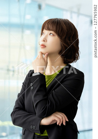 A woman thinking/businesswoman A woman thinking/businesswoman 127765982