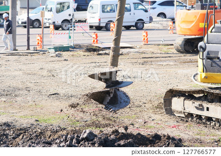 Earth auger during ground improvement work at a construction site 127766577