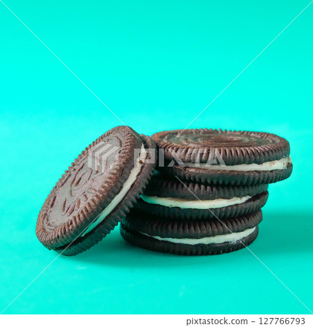 Chocolate cookie with cream on background. 127766793