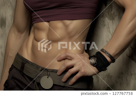 A woman`s athletic body. Abdominal muscles 127767758