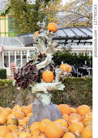 Traditional park decoration for Halloween with pumpkins in autumn Traditional park decoration for Halloween with pumpkins in autumn 127768163