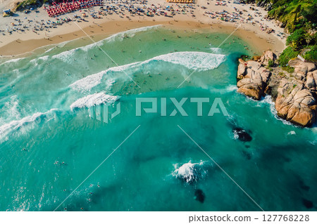 Joaquina beach with rocks and ocean with waves in Brazil. Drone view Joaquina beach with rocks and ocean with waves in Brazil. Drone view 127768228