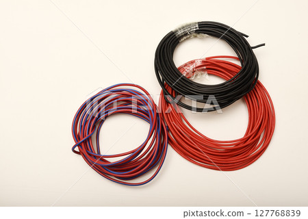 Bundles of copper connecting wires in rubber insulation. Multicolored wires. Bundles of copper connecting wires in rubber insulation. Multicolored wires. 127768839