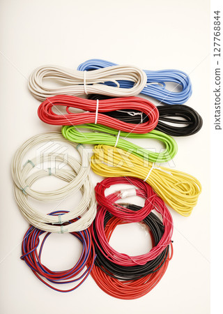 Coils of multicolored wires. Connecting wires for electronics. 127768844