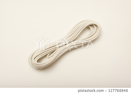 A coil of copper wire. Bundles of connecting wires. 127768848