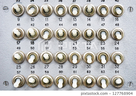 Mechanical switches on an old electrical device 127768904