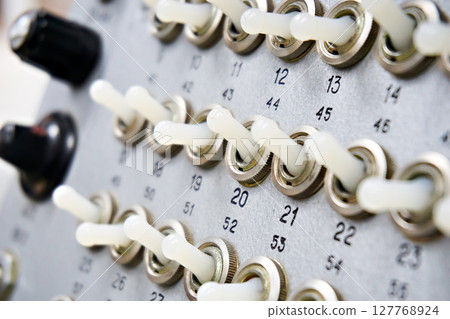 Mechanical switches on an old electrical device Mechanical switches on an old electrical device 127768924