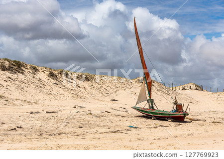 Fisherboats at Canoa Quebrada Beach at Aracati in Ceara, Brazil. Bay Coastline Fisherboats at Canoa Quebrada Beach at Aracati in Ceara, Brazil. Bay Coastline 127769923