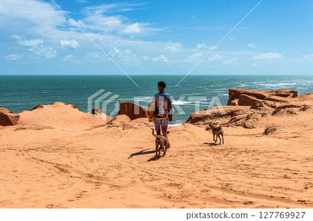 The rock formations at Canoa Quebrada Beach at Canoa Quebrada, state of Ceara, Brazil 127769927