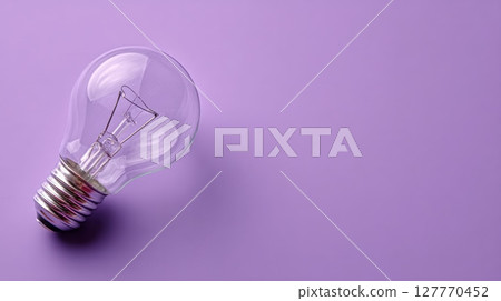 Glass light bulb on vibrant purple background. Neural network AI generated 127770452