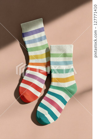 Colorful Striped Socks Mockup on Pastel Background with Soft Lighting 127771410